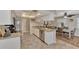 Bright kitchen has granite counters and stainless appliances conveniently located next to the dining area at 1048 Ulrey Ln, Englewood, FL 34223
