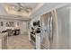 Bright kitchen boasts stainless steel appliances, granite counters, and white cabinetry at 1048 Ulrey Ln, Englewood, FL 34223
