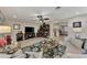 Expansive living room featuring tile floors, modern furniture, and seamless transition to the kitchen at 1048 Ulrey Ln, Englewood, FL 34223
