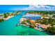 A stunning aerial view of a coastal community with waterfront property and boat access to the water at 109 Bayshore Rd # 10, Nokomis, FL 34275