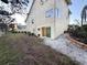 Spacious backyard with well-maintained lawn, lush landscaping, and a private patio at 109 Bayshore Rd # 10, Nokomis, FL 34275
