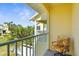 A condo balcony offers an outdoor seating area with lush landscaping and neighborhood views at 109 Bayshore Rd # 10, Nokomis, FL 34275