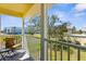 A cozy condo balcony provides relaxing outdoor seating with a scenic neighborhood view at 109 Bayshore Rd # 10, Nokomis, FL 34275