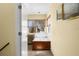 A bathroom featuring a soaking tub, a makeup vanity, tile flooring, and a window at 109 Bayshore Rd # 10, Nokomis, FL 34275
