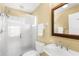 Bright bathroom featuring a walk-in shower with white tile and neutral-toned walls at 109 Bayshore Rd # 10, Nokomis, FL 34275