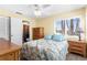 Bedroom with large window offering natural light and featuring a ceiling fan at 109 Bayshore Rd # 10, Nokomis, FL 34275