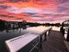 The property's private dock, ideal for boating and enjoying the beautiful sunset views over the water at 109 Bayshore Rd # 10, Nokomis, FL 34275