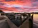 Dock at sunset, perfect for boating and enjoying the tranquil waterfront setting at 109 Bayshore Rd # 10, Nokomis, FL 34275