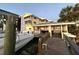 Beautiful water view with dock and lift, offering direct water access, a cabana, and a common area at 109 Bayshore Rd # 10, Nokomis, FL 34275