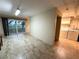 Empty Room with tile floors next to a Laundry area with appliances at 109 Bayshore Rd # 10, Nokomis, FL 34275