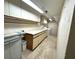 Well-lit laundry room with plentiful counter and cabinet space, plus a washer and dryer at 109 Bayshore Rd # 10, Nokomis, FL 34275