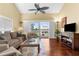 Inviting living room offering balcony access and stylish decor in a modern beach home at 109 Bayshore Rd # 10, Nokomis, FL 34275