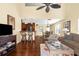 Open-concept living area with hardwood floors and a smooth transition to a modern kitchen at 109 Bayshore Rd # 10, Nokomis, FL 34275