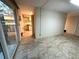 Bright living room with tile floor and sliding glass door leading to outdoor area at 109 Bayshore Rd # 10, Nokomis, FL 34275