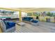 Comfortable outdoor lounge area with wicker furniture and plush cushions at 109 Bayshore Rd # 10, Nokomis, FL 34275