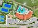 Aerial view of community clubhouse with pools, tennis courts, bocce ball, playground, and parking lot at 11803 Sistine Ln, Venice, FL 34293