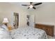 This light bedroom has coastal decor and is conveniently located near the bathroom and porch at 12565 Canavese Ln, Venice, FL 34293