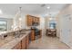 Well-equipped kitchen features granite countertops, stainless steel appliances, and an adjacent dining area at 12565 Canavese Ln, Venice, FL 34293