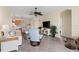 Spacious living room with tile floors, media center, and open floor plan at 12565 Canavese Ln, Venice, FL 34293