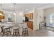 Open-concept living space featuring a kitchen, breakfast bar and entryway at 12565 Canavese Ln, Venice, FL 34293