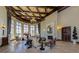 Clubhouse lobby boasts high ceilings, elegant chandeliers, a cozy fireplace, and comfortable seating areas at 12565 Canavese Ln, Venice, FL 34293