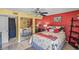 Comfortable bedroom with a ceiling fan, large closet and warm and inviting color scheme at 1555 Tarpon Center Dr # 255, Venice, FL 34285