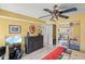 Stylish bedroom with a ceiling fan, wooden flooring, and ample space to live in at 1555 Tarpon Center Dr # 255, Venice, FL 34285