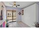 Cozy bedroom with sliding glass doors to balcony, and built-in wardrobe at 1555 Tarpon Center Dr # 255, Venice, FL 34285