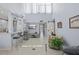 Expansive living area with high ceilings, tile floors, and abundant natural light with great flow through the home at 1555 Tarpon Center Dr # 255, Venice, FL 34285
