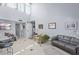 Spacious open-concept layout with bar, white kitchen, and bright living area for comfortable living and entertaining at 1555 Tarpon Center Dr # 255, Venice, FL 34285