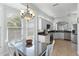 Bright eat-in kitchen boasting lots of windows and a view to the stainless steel kitchen at 1572 Monarch Dr, Venice, FL 34293