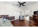 Living room featuring hardwood floors, comfortable seating, and natural lighting at 1572 Monarch Dr, Venice, FL 34293