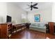 Living room featuring hardwood floors, neutral walls, and a comfortable seating area at 1572 Monarch Dr, Venice, FL 34293