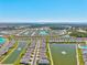 Community aerial view showcasing numerous homes surrounding scenic ponds and lush greenery at 1606 Cedar Valley Dr, Port Charlotte, FL 33953