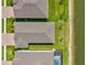 An aerial view showing the roofs, yards, and waterfront access of several homes at 1606 Cedar Valley Dr, Port Charlotte, FL 33953