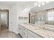 Bright bathroom with dual sinks, granite counters, and separate shower and tub at 1606 Cedar Valley Dr, Port Charlotte, FL 33953