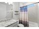 Bathroom with tiled tub and shower combination and modern fixtures at 1606 Cedar Valley Dr, Port Charlotte, FL 33953