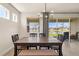 Inviting dining room with sliding glass doors and backyard lake view at 1606 Cedar Valley Dr, Port Charlotte, FL 33953