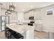 Well-lit kitchen featuring an island with seating and stainless steel appliances at 1606 Cedar Valley Dr, Port Charlotte, FL 33953