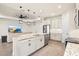 Spacious kitchen with a large island, stainless steel appliances, and modern lighting fixtures at 1606 Cedar Valley Dr, Port Charlotte, FL 33953