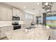 Modern kitchen featuring a large island, stainless steel appliances and views of the water at 1606 Cedar Valley Dr, Port Charlotte, FL 33953