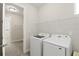 Convenient laundry room equipped with modern washer and dryer units at 1606 Cedar Valley Dr, Port Charlotte, FL 33953
