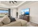 Bright living room with a large TV, lake view, and neutral decor at 1606 Cedar Valley Dr, Port Charlotte, FL 33953