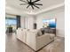 Spacious living room with a lake view, comfortable seating and neutral decor at 1606 Cedar Valley Dr, Port Charlotte, FL 33953