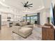 Open floor plan living room with a lake view and access to the kitchen at 1606 Cedar Valley Dr, Port Charlotte, FL 33953