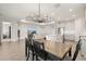 Open floor plan featuring modern kitchen with a center island and an adjacent dining area at 1606 Cedar Valley Dr, Port Charlotte, FL 33953