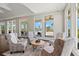 Relaxing lounge area with comfortable seating, large windows, and a view of the pool at 1606 Cedar Valley Dr, Port Charlotte, FL 33953