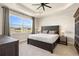 Serene main bedroom with a large window and backyard lake view at 1606 Cedar Valley Dr, Port Charlotte, FL 33953