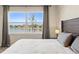 Cozy bedroom with large window and backyard lake view at 1606 Cedar Valley Dr, Port Charlotte, FL 33953
