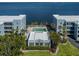 Aerial view of the condo complex, pool, landscaping and the ocean in the background at 1750 Jamaica Way # 322, Punta Gorda, FL 33950